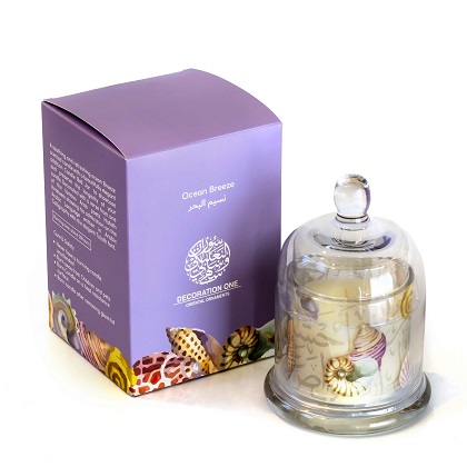 Candle in a glass bell jar with a cover, filled with an ocean breeze scent candle. The bell jar is adorned with shells and an Arabic verse from the poet Hafiz Ibrahim asking about his sea shells: أنا البحر فى أحشائه الدر كامن..فهل سألوا الغواص عن صدفاتى؟! Empty أنا البحر فى أحشائه الدر كامن..فهل سألوا الغواص عن صدفاتى؟!
