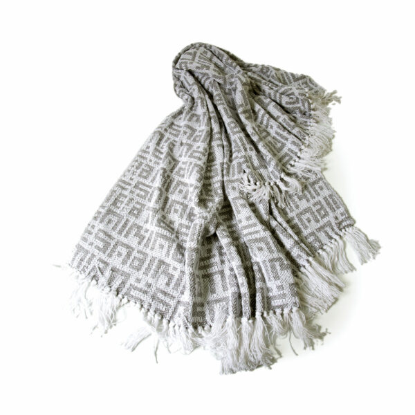 grey and white cotton throw"